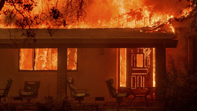 TOPSHOT - Flames engulf a home during the Thompson fire in Oroville, California on July 2, 2024. A heatwave is sending temperatures soaring resulting in red flag fire warnings throughout the state. (Photo by JOSH EDELSON / AFP) (Photo by JOSH EDELSON/AFP via Getty Images)